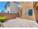 Backyard with interlock patio, rock features, and minimal landscaping at 3757 Via Geneva, Henderson, NV 89052