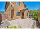 The backyard of the property features a charming interlock patio and minimal landscaping at 3757 Via Geneva, Henderson, NV 89052