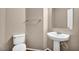Powder room featuring pedestal sink, toilet and modern fixtures at 3757 Via Geneva, Henderson, NV 89052