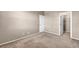 Neutral bedroom featuring carpeted floors and doors to both the closet and the hallway at 3757 Via Geneva, Henderson, NV 89052