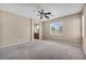Spacious primary bedroom featuring neutral paint, carpet, bright light and ceiling fan at 3757 Via Geneva, Henderson, NV 89052