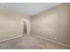 Spacious, neutral bedroom with plush carpeting and doorway to walk-in closet at 3757 Via Geneva, Henderson, NV 89052