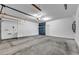 Spacious two car garage, featuring concrete floors and white walls at 3757 Via Geneva, Henderson, NV 89052