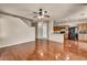 Spacious living room with hardwood floors, ceiling fan, neutral tones, and stairway to upper level at 3757 Via Geneva, Henderson, NV 89052