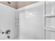 Clean shower features a built-in soap dish, shower head and tile surround at 3757 Via Geneva, Henderson, NV 89052