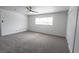 Spacious bedroom with a ceiling fan, a window, and large closet space at 4269 Roanridge Ave, Las Vegas, NV 89120