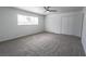 Large bedroom with neutral carpet, window, and large double closets at 4269 Roanridge Ave, Las Vegas, NV 89120