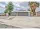 Charming single-story home with a spacious driveway and mature trees in a well-kept yard at 4269 Roanridge Ave, Las Vegas, NV 89120