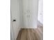 Hallway with vinyl wood flooring, white storage closet and door at 4269 Roanridge Ave, Las Vegas, NV 89120