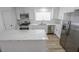 Updated kitchen with stainless steel appliances, white cabinets, and marble countertops at 4269 Roanridge Ave, Las Vegas, NV 89120