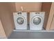 The laundry area includes both a washing machine and dryer, offering convenience for laundry needs at 4269 Roanridge Ave, Las Vegas, NV 89120