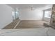 Open living area showcasing the stone fireplace and seamless flow into the kitchen at 4269 Roanridge Ave, Las Vegas, NV 89120