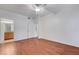 Spacious bedroom with wood floors, a ceiling fan, and an ensuite bathroom at 4400 S Jones Blvd # 1125, Las Vegas, NV 89103