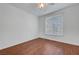 Well-lit bedroom featuring wood floors and a window at 4400 S Jones Blvd # 1125, Las Vegas, NV 89103