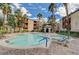 Community pool with palm trees, lounge chairs, and gazebo offer resort-style living at 4400 S Jones Blvd # 1125, Las Vegas, NV 89103