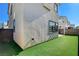The backyard features artificial turf, and a private outdoor living space at 532 Monarch Ridge Ct, North Las Vegas, NV 89084