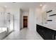 Modern bathroom features a glass shower and tub, along with double sinks at 532 Monarch Ridge Ct, North Las Vegas, NV 89084