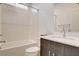 Clean bathroom featuring a shower-tub combo, modern vanity, and white subway tile at 532 Monarch Ridge Ct, North Las Vegas, NV 89084