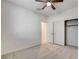 This bedroom includes carpet, a ceiling fan, closet space, and neutral paint at 532 Monarch Ridge Ct, North Las Vegas, NV 89084