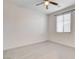 This spacious bedroom features a ceiling fan and a bright window at 532 Monarch Ridge Ct, North Las Vegas, NV 89084