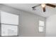 This bright bedroom features neutral paint, carpet, and a ceiling fan at 532 Monarch Ridge Ct, North Las Vegas, NV 89084