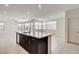 Kitchen island with sink and a full view of the open kitchen and living area at 532 Monarch Ridge Ct, North Las Vegas, NV 89084