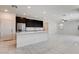 Spacious living area adjacent to kitchen featuring tiled floors and recessed lighting throughout at 532 Monarch Ridge Ct, North Las Vegas, NV 89084