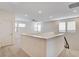 Open, airy loft area with neutral carpet, several windows, and a ceiling fan at 532 Monarch Ridge Ct, North Las Vegas, NV 89084