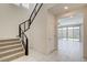 Modern staircase with carpeted treads and sleek, black railing leading to the upper level at 532 Monarch Ridge Ct, North Las Vegas, NV 89084