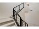 Carpeted staircase with metal railings at 532 Monarch Ridge Ct, North Las Vegas, NV 89084