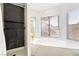 Bathroom showcasing a shower and separate soaking tub with marble surround and bright, natural light at 5570 Palm St, Las Vegas, NV 89120