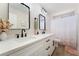 Bright bathroom features double sinks, sleek fixtures, and modern vanity at 5570 Palm St, Las Vegas, NV 89120