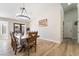 Dining room with natural light and wood-look flooring at 5570 Palm St, Las Vegas, NV 89120