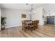 Dining room with a chandelier and wood-look flooring at 5570 Palm St, Las Vegas, NV 89120