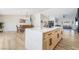 Open-concept layout featuring a large kitchen island and a dining area at 5570 Palm St, Las Vegas, NV 89120