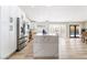 Modern kitchen featuring white cabinets, stainless steel appliances, and a large marble island at 5570 Palm St, Las Vegas, NV 89120