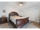 Main bedroom with dark-wood furniture and a ceiling fan at 5570 Palm St, Las Vegas, NV 89120