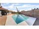 Inviting swimming pool with patio seating and views of lush landscaping at 5570 Palm St, Las Vegas, NV 89120