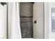Walk-in shower features sleek, dark tile, modern fixtures and bright natural light at 5570 Palm St, Las Vegas, NV 89120