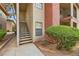Close-up of condo exterior, featuring well-maintained landscaping, stairs, and building details at 5576 W Rochelle Ave # 27C, Las Vegas, NV 89103