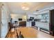 Open living space showcasing a kitchen, dining area, and living room, creating a cohesive and inviting atmosphere at 5576 W Rochelle Ave # 27C, Las Vegas, NV 89103