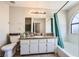 Bright bathroom with a shower-tub combo and a spacious vanity at 5754 Cinnabar Ave, Las Vegas, NV 89110