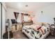 A comfortably decorated bedroom with a large window providing natural light at 5754 Cinnabar Ave, Las Vegas, NV 89110