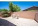 Private backyard with a paved patio area and lush landscaping, great for outdoor enjoyment at 7252 Blowing Breeze Ave, Las Vegas, NV 89179