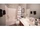 Inviting full bathroom features a combined tub and shower, neutral decor, and a functional single sink vanity at 7252 Blowing Breeze Ave, Las Vegas, NV 89179