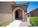 Charming front porch featuring stone accents and a welcoming entrance with an ADT security sign at 7252 Blowing Breeze Ave, Las Vegas, NV 89179