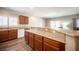 Kitchen bar features granite countertops and stylish wood cabinets at 7252 Blowing Breeze Ave, Las Vegas, NV 89179