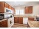 Kitchen with granite counters, stainless appliances, and ample cabinet space at 7252 Blowing Breeze Ave, Las Vegas, NV 89179