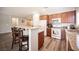 Kitchen with granite countertops, stainless appliances, and bar seating at 7252 Blowing Breeze Ave, Las Vegas, NV 89179