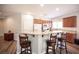 Kitchen with granite countertops and bar seating at 7252 Blowing Breeze Ave, Las Vegas, NV 89179